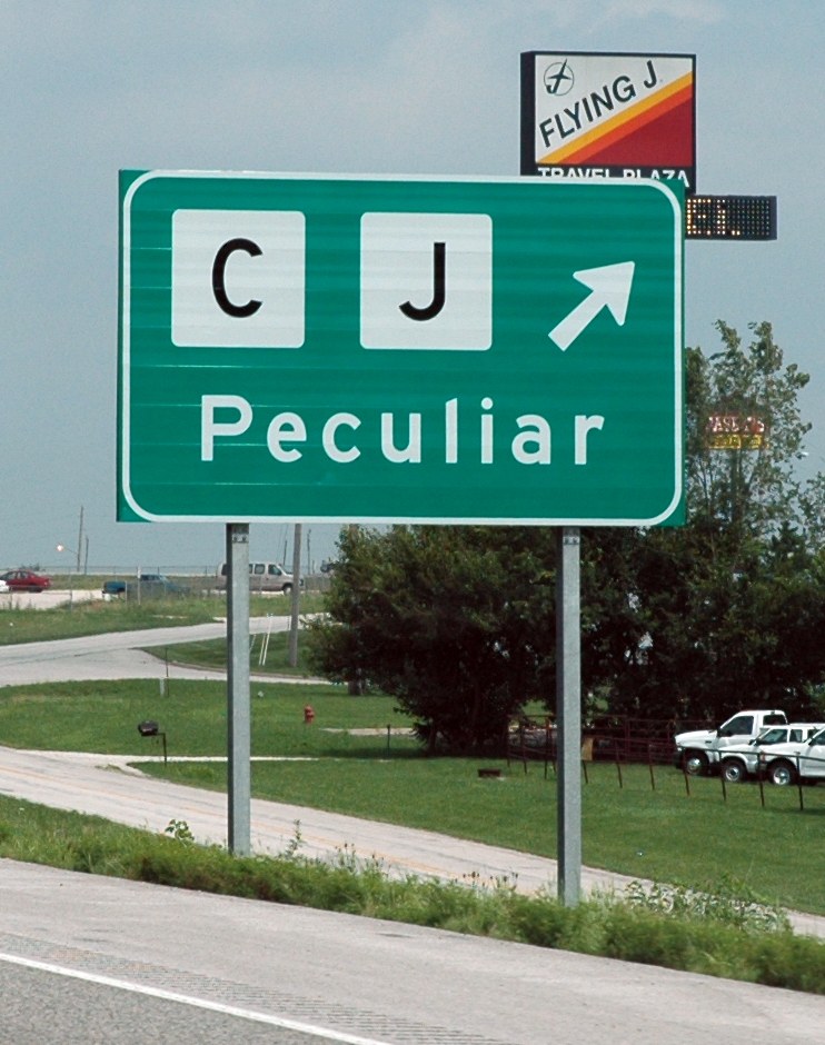 Welcome sign for Peculiar, MO — "Where the odds are with you"